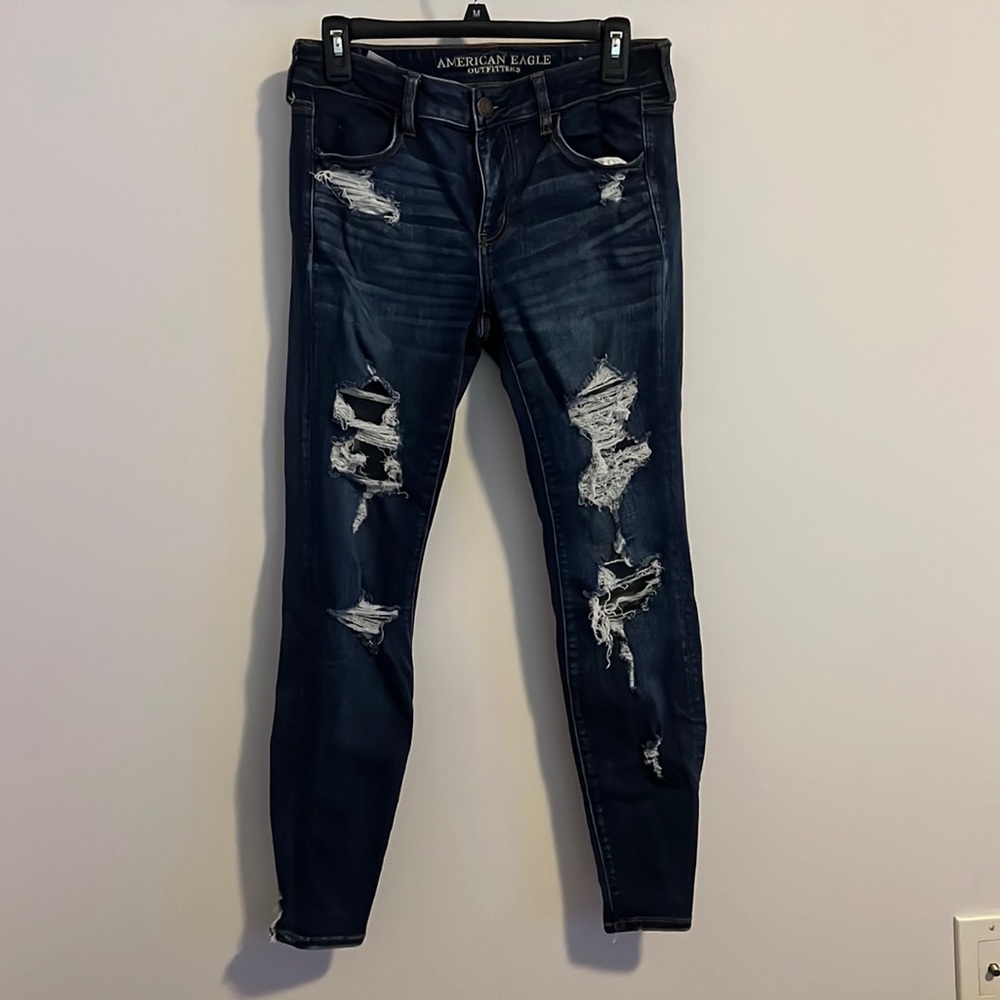 Size 10 MidRise American Eagle StretchX Jegging - Dark Blue Ripped “HELL YEAH”